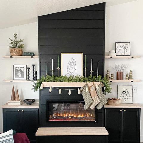 Touchstone Sideline Elite Smart Electric Fireplace in black shiplap wall with light wood mantel