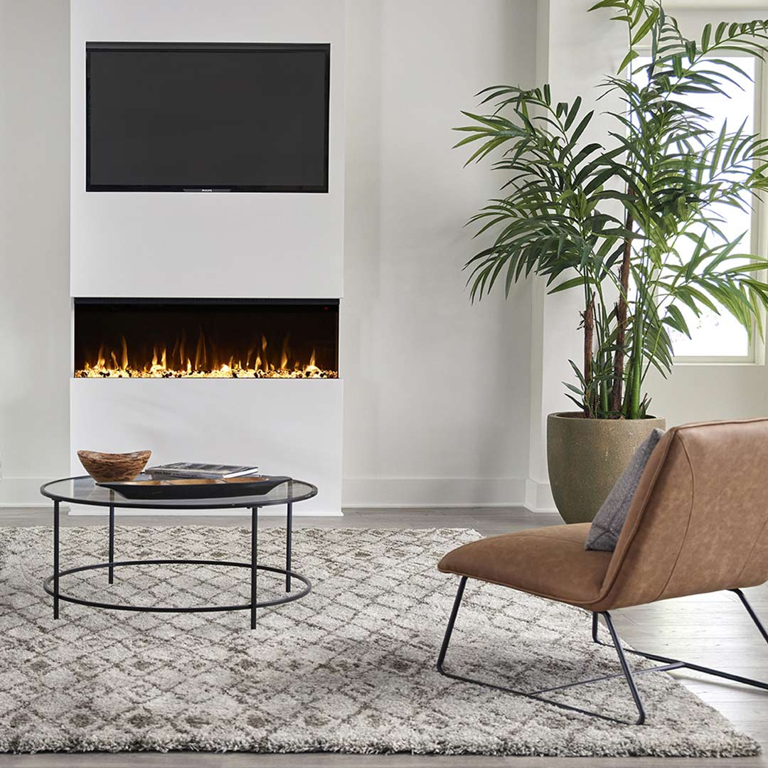 Touchstone Sideline Infinity Smart Electric Fireplace front view with orange and white flame display in modern living room