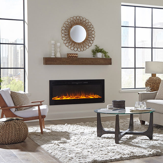 Touchstone Sideline 50 Smart Electric Fireplace inserted in a light color wall with oak wood mantel and mirror above