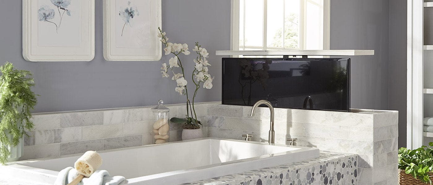 Touchstone TV Lift Mechanism installed in cabinet at the end of the bathtub.