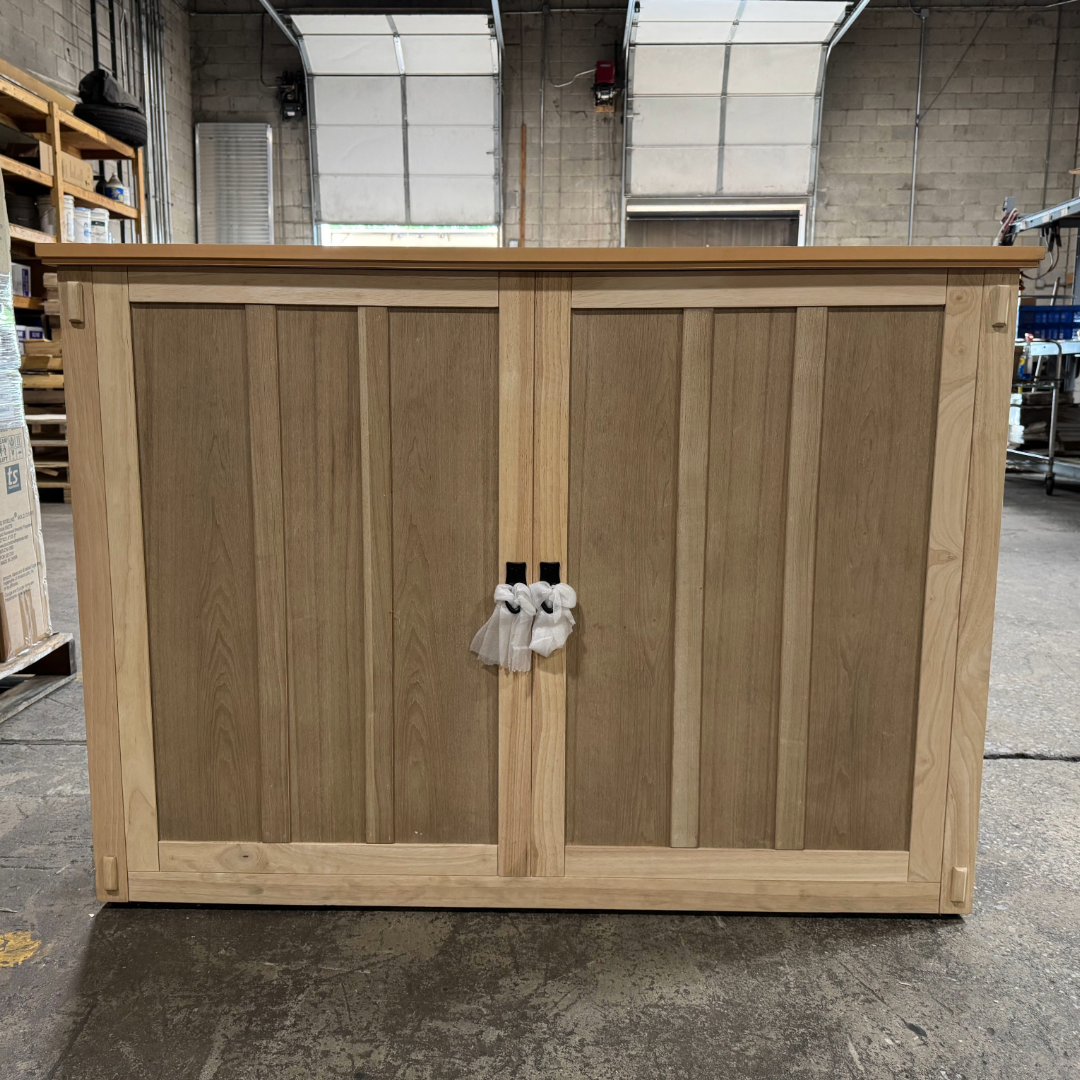 Touchstone Elevate Mission Smart TV Lift Cabinet in unfinished photographed in the warehouse - showroom unit.