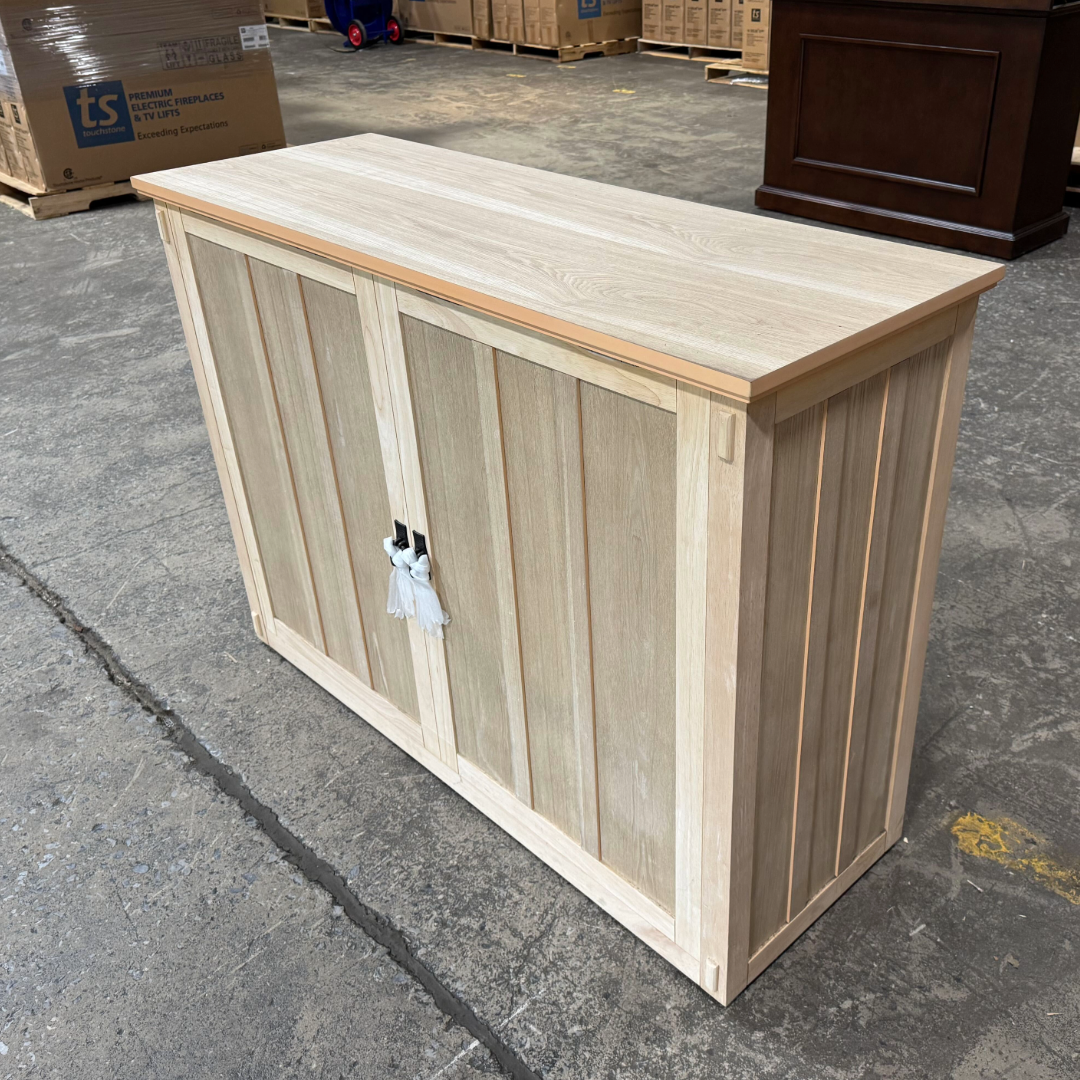 Touchstone Elevate Mission Smart TV Lift Cabinet in unfinished photographed in the warehouse - showroom unit.