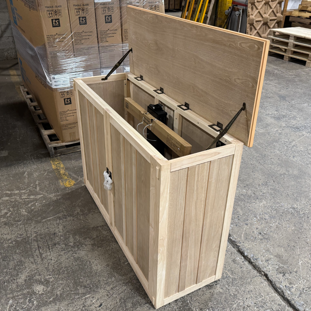 Touchstone Elevate Mission Smart TV Lift Cabinet in unfinished photographed in the warehouse - showroom unit.