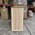 Touchstone Elevate Mission Smart TV Lift Cabinet in unfinished photographed in the warehouse - showroom unit.