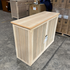 Touchstone Elevate Mission Smart TV Lift Cabinet in unfinished photographed in the warehouse - showroom unit.