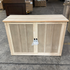 Touchstone Elevate Mission Smart TV Lift Cabinet in unfinished photographed in the warehouse - showroom unit.