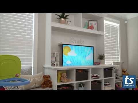 Touchstone TV lift mechanism hides a TV in a built in shelf.