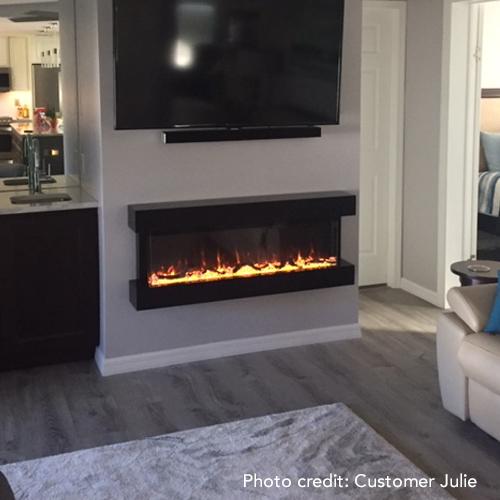 The Touchstone Chesmont 3 sided electric fireplace installed on a wall in the living room