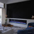 Touchstone Sideline Elite 100 Smart Electric Fireplace in modern living room with black accent wall